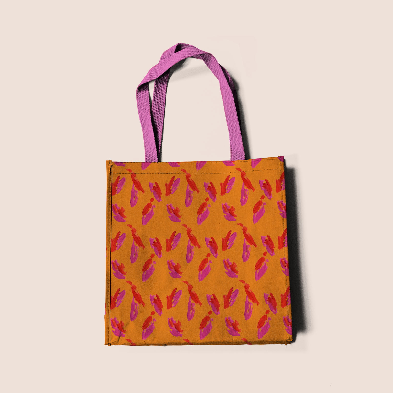 Paint brush strokes red and pink in orange pattern design printed on recycled fabric crafts mockup