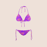 Load image into Gallery viewer, All eyes millennial in purple pattern design printed on recycled fabric bikini mockup
