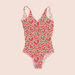 Load image into Gallery viewer, Hearts millennial in pink pattern design printed on recycled fabric swimsuit mockup
