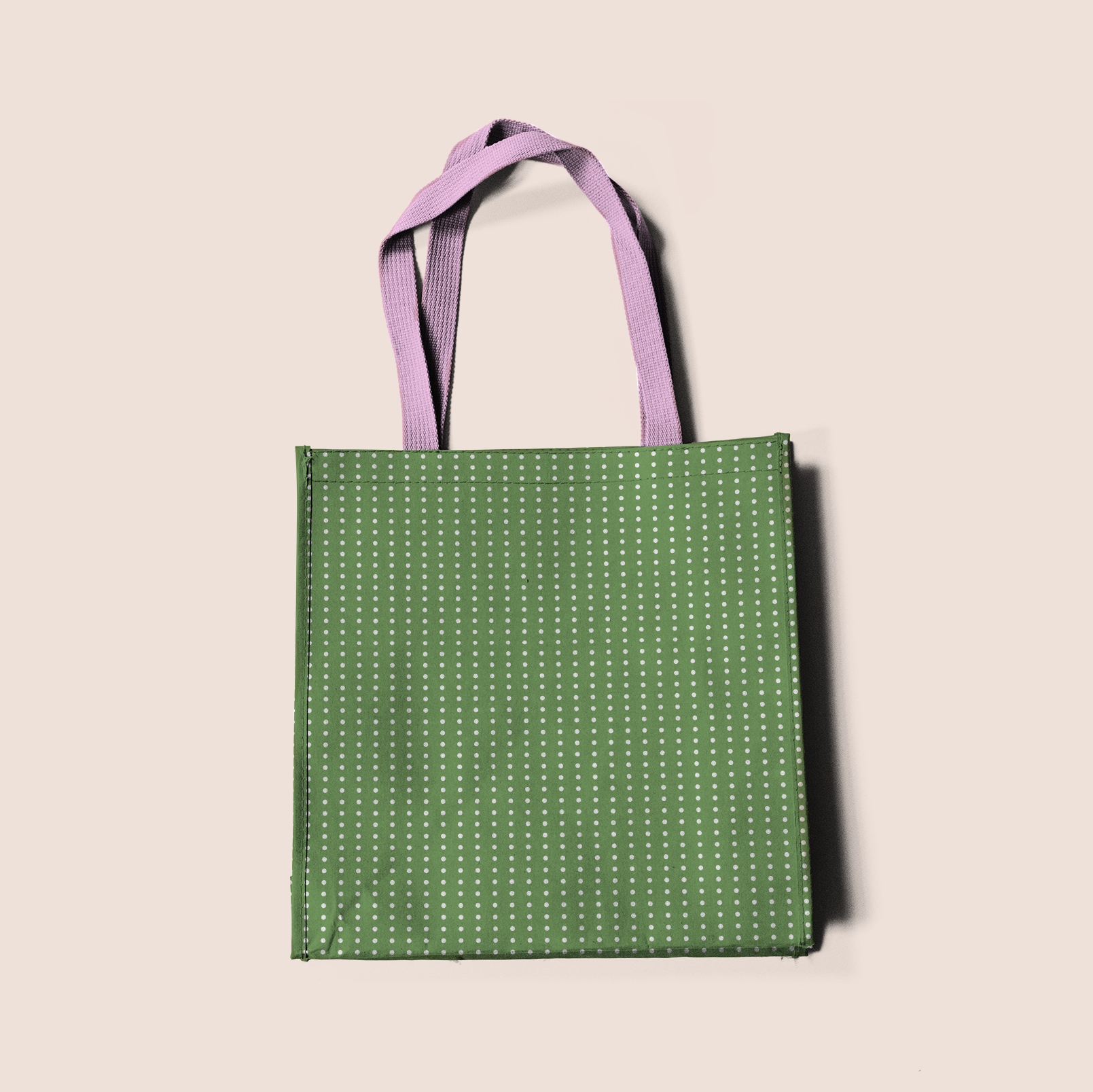 Aligned dots in green pattern design printed on recycled fabric bag and crafts mockup