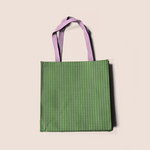 Load image into Gallery viewer, Aligned dots in green pattern design printed on recycled fabric bag and crafts mockup

