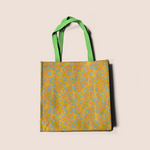 Load image into Gallery viewer, Modern flowers in yellow pattern design printed on recycled fabric bags mockup

