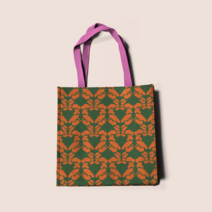 Symmetry decor in orange on green pattern design printed on recycled fabric crafts
