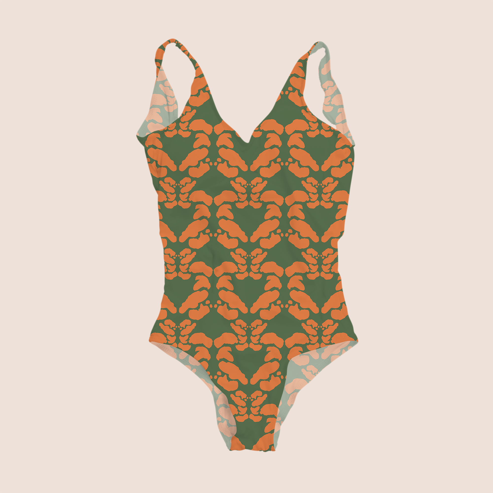 Symmetry decor in orange on green pattern design printed on recycled fabric lycra